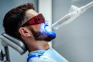 fluoride treatments tx, man getting dental treatment