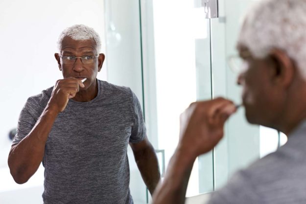 healthy-gums man brushing to get healthy gums