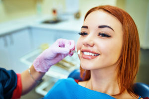 woman who needs dental crowns