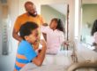 Father Helping Kids Brush Their Teeth