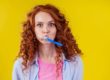 Woman Brushing Teeth To Care For Dental Health