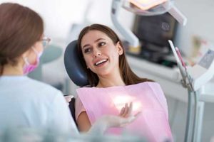 patient in dental chair getting preventative dentistry