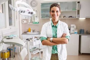 dentist smiling with arms crossed ready to provide restorative dentistry