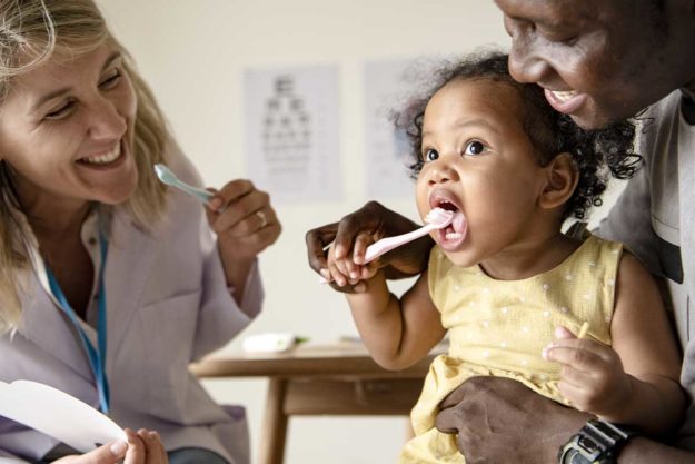 How to Choose a Pediatric Dental Office (2) parent with child after choosing a pediatric dental office