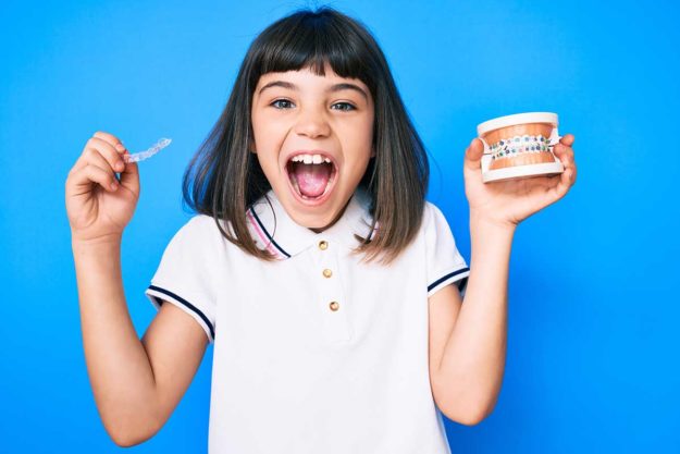 3 Benefits of braces for kids young girl getting braces for kids